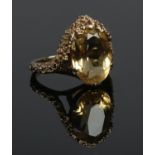 A vintage 9ct gold ring set with a large citrine stone. Assayed London 1972. Size K. 5.22g.