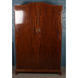 A mahogany double wardrobe. With one mirrored door and fitted interior.