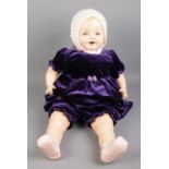 A large vintage doll. Soft bodied with squeaker, moulded hair, sleeping blue eyes, Made in Canada.