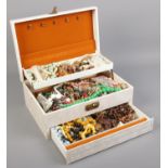 A jewellery box with contents. Including beads, necklaces, earrings, etc.