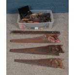 A large quantity of vintage tools; to include saws, spirit level and woodworking files.