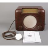 A Bakelite Bush DAC90A Vintage Radio, complete with instruction booklet.