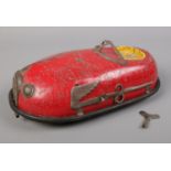 An American tin plate wind-up bumper car. L: 23cm. Winds up but will need attention. Comes with