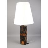 A wooden table lamp made with printing press letters with shade. Lamp height: 40.5cm. In working