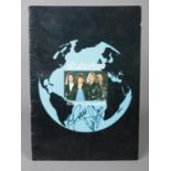 A Status Quo programme; Rocking all over the World, signed by members Francis Rossi and Rick