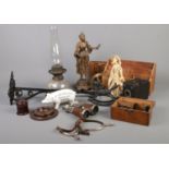 A quantity of miscellaneous. WM Molands sons cast iron butchers money box pig, glass oil lamp with