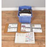 A quantity of stamps and approximately 100 first day covers, together with several blank albums
