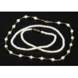 Two Pearl necklaces. To include a 9ct gold clasp necklace separated by gold spacers and a single row