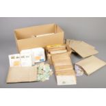 A box containing a very large quantity of loose GB stamps, along with approximately 85 first day