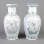 A large pair of oriental ceramic vases with transfer print decoration. 47cm high.