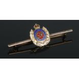 A 9ct Gold and enamel Royal Engineers bar brooch. Total weight: 3.6g