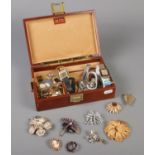 A jewellery box and contents of costume jewellery. To include vintage brooches, Accurist & Fero