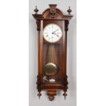 A mahogany cased Kieninger wall clock. With pendulum and key.