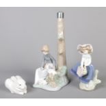 A small collection of Lladro and Nao ceramics, to include table base, and 'Pretty Pickings' flower