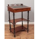 A Victorian mahogany open davenport with turned supports. Fretwork gallery loose and in need of