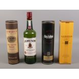 Four bottles of assorted whisky, to include Glenmorangie and Glenfiddich. Glenfiddich seal is broken