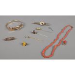 A quantity of vintage Jewellery & coral. To include 18ct gold plated bangle, brooches & hat pins.