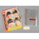 The Beatles; a collection of memorabilia, to include programme, scrap book and business card.