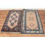 Two wool cream ground rugs with floral border detailing. (1) 140cm x 70cm (2) 135cm x 62cm.