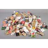 A large quantity of vintage matchboxes and matches in sleeves.
