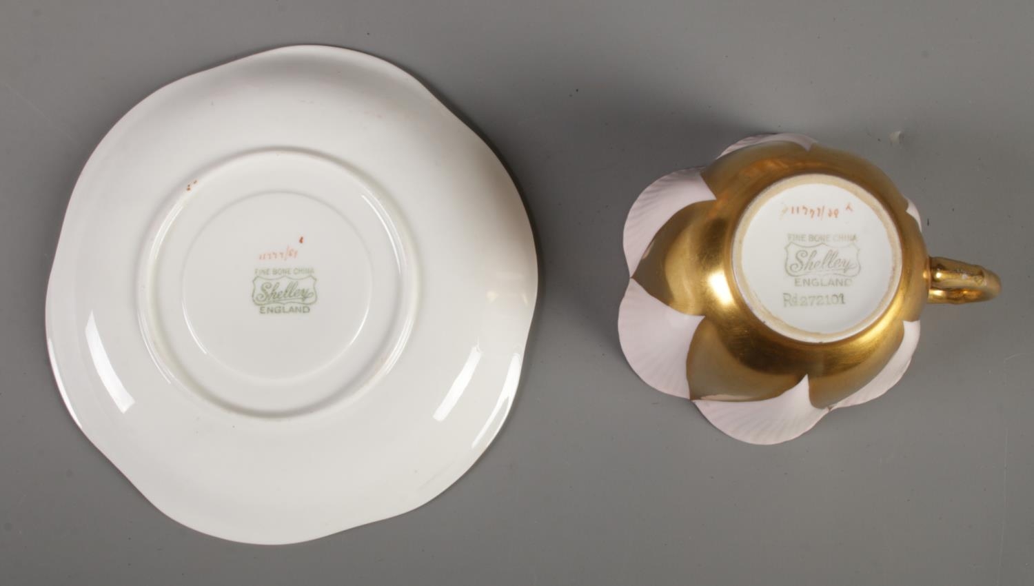 A Shelley 'Danity' part tea set. Comprising of six cups and saucers in pink and gold. One cup with - Image 2 of 2