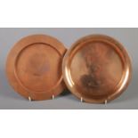 Two Copper plates. To include a Birmingham Guild plate with stamped rim and another example made