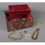 A quantity of costume jewellery. To include beads, necklaces, brooches etc