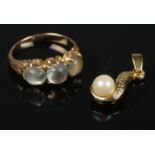 A yellow metal Moonstone ring and yellow metal faux pearl pendant. Ring Size: M1/2. Gross weight: