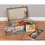 A vintage suitcase & board games. To include Waddington's Slam, Battleships, Steeplechase etc