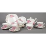 A Windsor bone china part tea set. To include teapot, cups/saucers, plates etc
