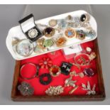 A quantity of costume jewellery. Brooches, bangles etc