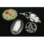 Four brooches. To include a white metal feather Whitby Jet brooch, a Wedgwood cameo, a micro-