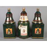 Three boxed and sealed 70cl Bells Christmas Decanters; from 1991 and 1994 x2.