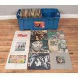 A large storage box containing a good collection of rock and pop vinyl records. To include The