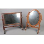 Two antique mahogany toilet mirrors.