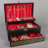 A jewellery box and contents of costume jewellery. Necklaces, rings, beads etc.