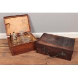 Two vintage briefcases with contents. Including glass and silver plate ewer, decanters. etc.