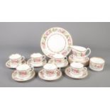 A Royal Worcester "Royal Garden" pattern part tea set. Comprising of six cups, saucers, side plates,