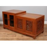 An Oriental carved hardwood cabinet.