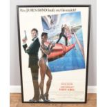 A framed original James Bond film poster; 'A View to a Kill', starring Roger Moore. Produced by