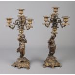 A pair of Souchal bronze three branch candelabras. Decorated with women and foliage. Stamped Souchal