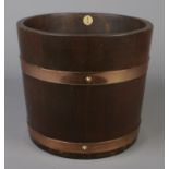 A brass bound mahogany barrel by R.A Lister & Co Ltd. Height 27cm, Diameter 31cm.