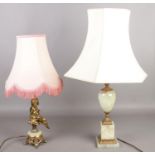 Two onyx and gilt table lamps. Including figural example.