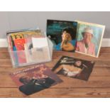 A quantity of 45 rpm & LP vinyl records. Shirley Bassey, Ella Fitzgerald, Louis Armstrong etc
