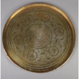 A large Eastern brass charger. 69cm diameter.