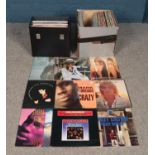 A large box and carry case of Rock, Pop and Reggae single and album vinyl records. To include