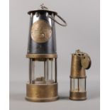 Two Protector Lamp & Lighting Co Ltd safety miners lamps.