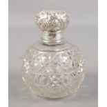 An Edwardian silver topped scent bottle with stopper. Assayed Birmingham 1902.