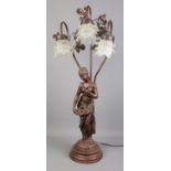 A large composite figural table lamp with background foliage and three frosted glass shades. 84cm