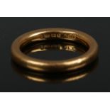 A 22ct gold wedding band. Size K. 5.7g.